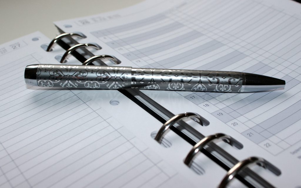 This is a photo of a pen on an appointment book