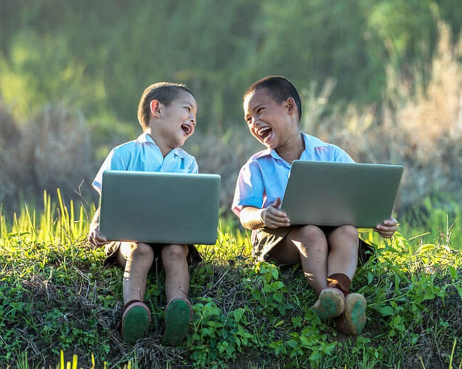 school website design services represented by two children looking at computers