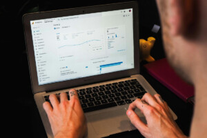 Man looking at Google Analytics on laptop