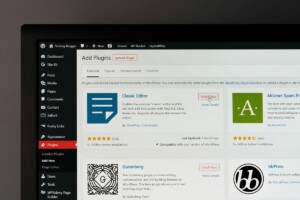 Photo of a computer monitor screen showing the Plugins section of the WordPress Dashboard
